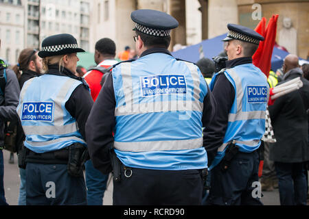 Police Liaison Officer watching over proceedings at the March Against Racism national demonstration, which started at Portland Place, London, UK. Stock Photo
