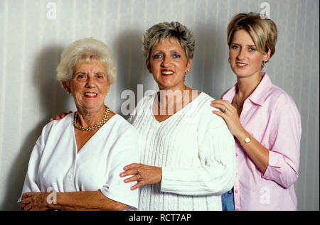 Three generations of women with similar features Stock Photo