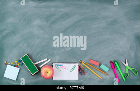 Back to school concept with green erased chalkboard and a variety of ...