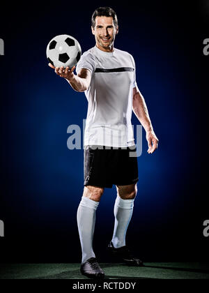 one caucasian soccer player man isolated on black background Stock Photo