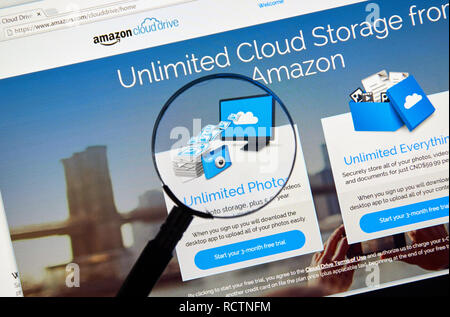 MONTREAL, CANADA - MAY 8, 2016 : Amazon Cloud Drive web page under magnifying glass. Amazon Cloud Drive is a web storage application from Amazon. Stock Photo