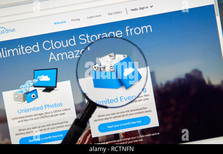 MONTREAL, CANADA - MAY 8, 2016 : Amazon Cloud Drive web page under magnifying glass. Amazon Cloud Drive is a web storage application from Amazon. Stock Photo