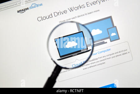 MONTREAL, CANADA - MAY 8, 2016 : Amazon Cloud Drive web page under magnifying glass. Amazon Cloud Drive is a web storage application from Amazon. Stock Photo