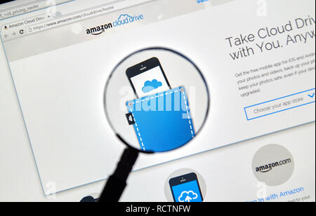 MONTREAL, CANADA - MAY 8, 2016 : Amazon Cloud Drive web page under magnifying glass. Amazon Cloud Drive is a web storage application from Amazon. Stock Photo