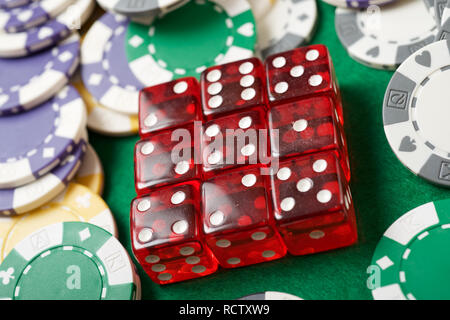 casino chips and dices on a green felt Stock Photo