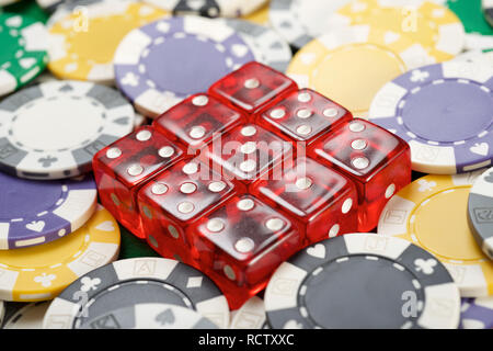 casino chips and dices on a green felt Stock Photo