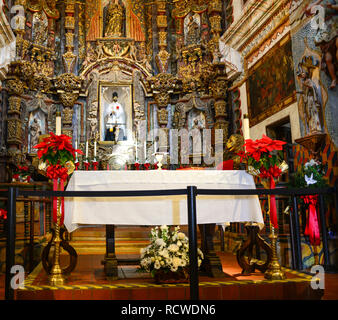 Inside the beautiful and ornate chapel at the historical Mission San Xavier del Bac, a Spanish Catholic Mission near Tucson, AZ Stock Photo