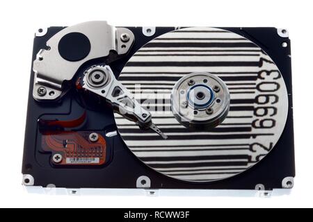 Computer hard drive, opened, read-write head on the disk, bar code reflected in the disc, symbolic image Stock Photo