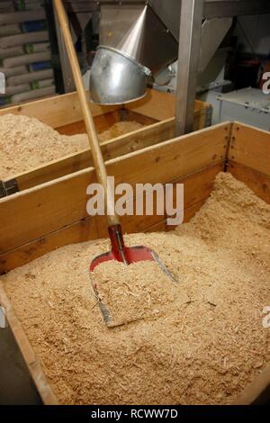 Raw wood chips for the manufacture of wood pellets for heating, at the WestPellets company in Titz, North Rhine-Westphalia Stock Photo