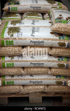 Wood pellets for heating packaged in sacks, at the WestPellets company in Titz, North Rhine-Westphalia Stock Photo