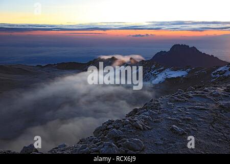 At sunrise, clouds in the crater of Mount Kilimanjaro, Tanzania, Africa Stock Photo