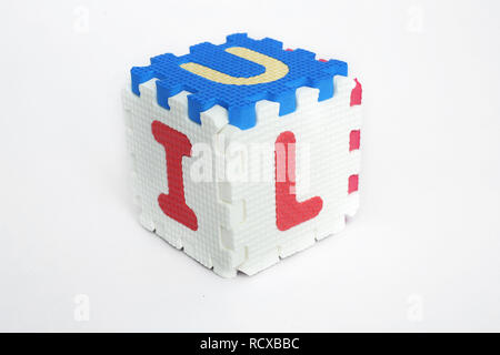 Portrait of blocks forming cube with letter. Isolated on the white background. Stock Photo