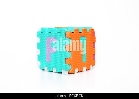 Block forming cube with alphabets. Isolated on the white background. Stock Photo