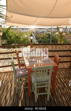 Cozy outdoor cafe at sunset in Kas, Mediterranean coast, Turkey Stock Photo