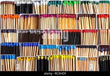 Matches in matchboxes, with different coloured match heads and sticks Stock Photo