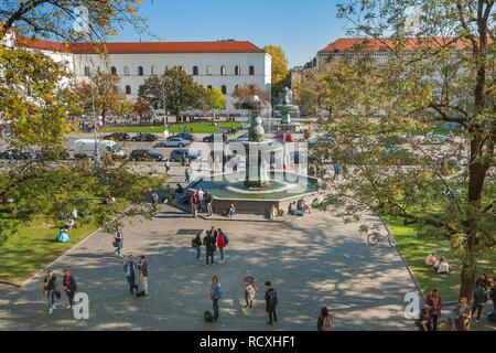 The Geschwister-Scholl-Platz with its fountain, forecourt of the Ludwig-Maximilians-University, Munich, Upper Bavaria, Bavaria Stock Photo