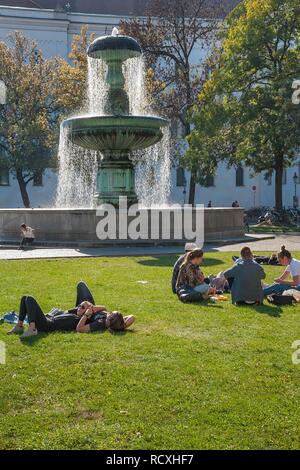 The Geschwister-Scholl-Platz with its fountain, forecourt of the Ludwig-Maximilians-University, Munich, Upper Bavaria, Bavaria Stock Photo