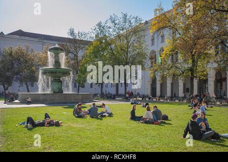 The Geschwister-Scholl-Platz with its fountain, forecourt of the Ludwig-Maximilians-University, Munich, Upper Bavaria, Bavaria Stock Photo