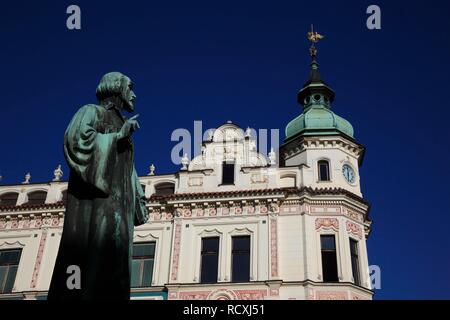 Jan Hus monument in front of a historic building of the Prague archbishops, Roudnice nad Labem, North Bohemia, Bohemia Stock Photo