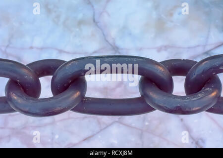 The big chain on the marble floor. Stock Photo