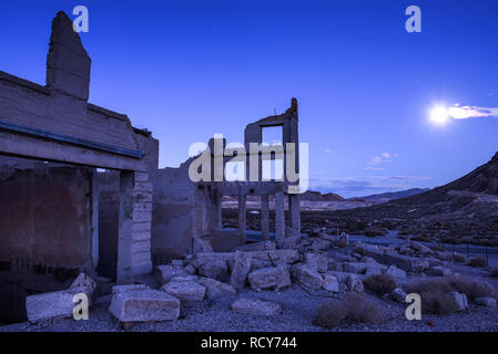 Abandoned building in Rhyolite, Nevada at night with full moon Stock Photo