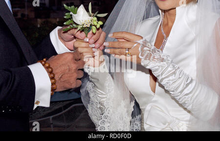 Close-up of a bride and groom with a flower corsage Stock Photo