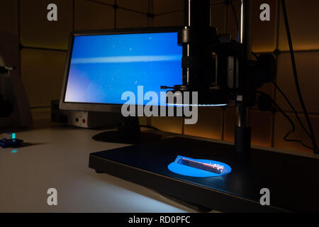 Quality control of optical glass in the laboratory Stock Photo