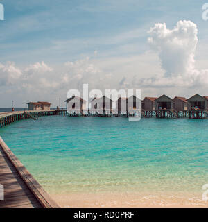 Love on Paradise island, concept. Bungalow on stilts in the water, amazing tropical nature. Maldives resort, the private island, solitude for tourists Stock Photo
