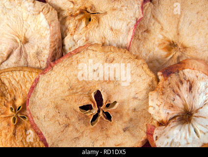 Slices of dried apple as a background. Closeup image Stock Photo