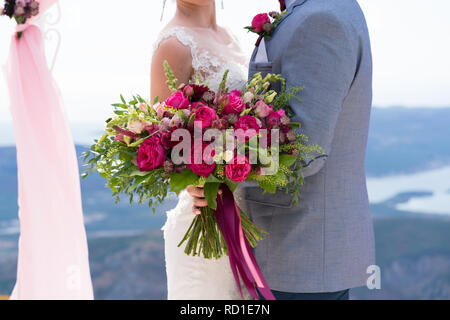 bright bouquet of various red and pink flowers Stock Photo