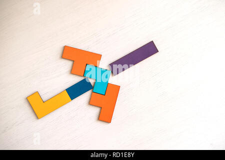 Plane made from tangram puzzle on table. Stock Photo
