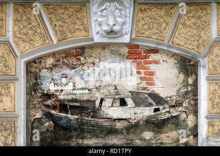 The old boat is cast ashore. Drawing on the old wall. Photo collage Stock Photo