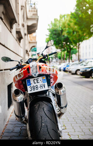 PARIS, FRANCE - JUN 27, 2015: Rear view of Aprilia 1000 RSV4 RR sport bike motorcycle made by Italian company Aprilia parked on a street Stock Photo
