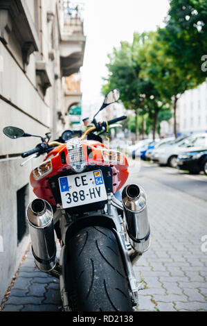 PARIS, FRANCE - JUN 27, 2015: Rear view of powerful Aprilia 1000 RSV4 RR sport bike motorcycle made by Italian company Aprilia parked on a street Stock Photo