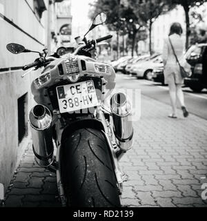 PARIS, FRANCE - JUN 27, 2015: Rear view of Aprilia 1000 RSV4 RR sport bike motorcycle made by Italian company Aprilia parked on a street - black and white Stock Photo