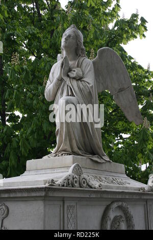 Statue of angel praying - cemetery in St.Petersburg Stock Photo