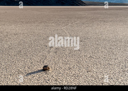 Sailing rocks leave trails in the mud as they move, Racetrack Playa, Death Valley National Park, California Stock Photo