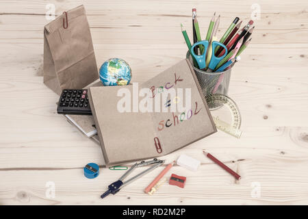 Back to school template with school stationeries on wooden table Stock Photo