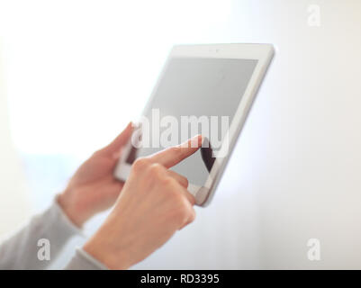 close up.woman's hand pressing on screen digital tablet .photo w Stock Photo