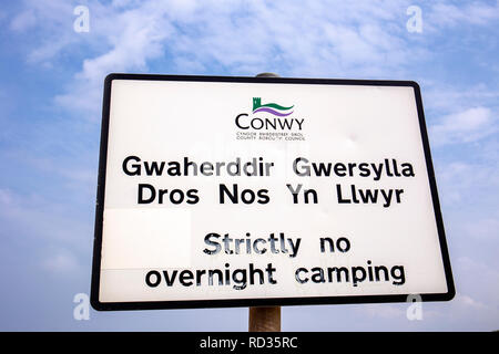 Strictly no overnight camping sign in English and Wales language as told by Conwy County Borough Council, Wales UK Stock Photo