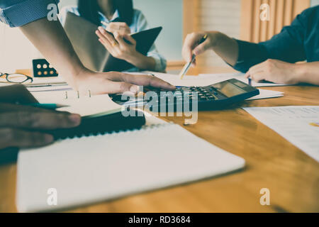 Business team meeting and discussing project plan. Businessmen discussing together in meeting room. Stock Photo