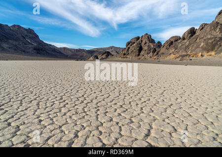 Dry lake bed formed polygon patterns, usually 6 sided, Racetrack Playa and The Grandstand Island, Death Valley National Park, California Stock Photo