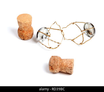 Two corks from champagne wine and muselets. Isolated on white background. Selective focus. Stock Photo