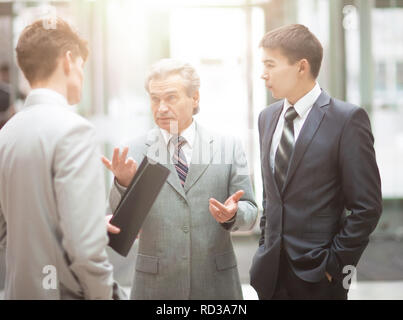 Director and business team to discuss the presentation of a new financial project in a modern office Stock Photo