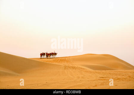 A camel caravan in the Rub' al Khali desert. Stock Photo