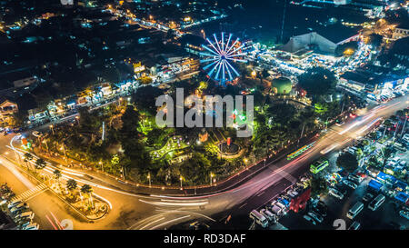 Aerial view of Alun Alun Malang at night, featuring a central circular ...