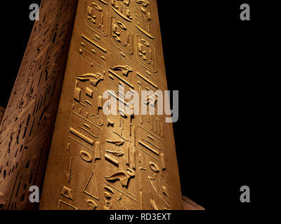 The only remaining obelisk at Temple of Luxor illuminated at night detail image Stock Photo