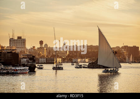 Sunset on Nile River with traditional boats at Luxor Thebes Egypt Stock Photo