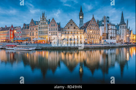 Panoramic view of famous Graslei in the historic city center of Ghent illuminated in beautiful post sunset twilight during blue hour at dusk Stock Photo