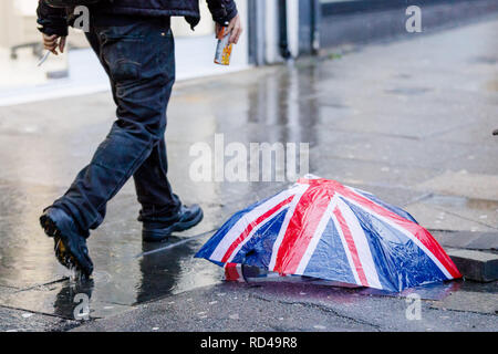 London, UK. 16th January, 2019. Broken Britain. A broken Union Jack umbrella sums up the political position of the UK following Prime Minister Theresa May's historic defeat on her Brexit deal yesterday. Credit: Amanda Rose/Alamy Live News Stock Photo